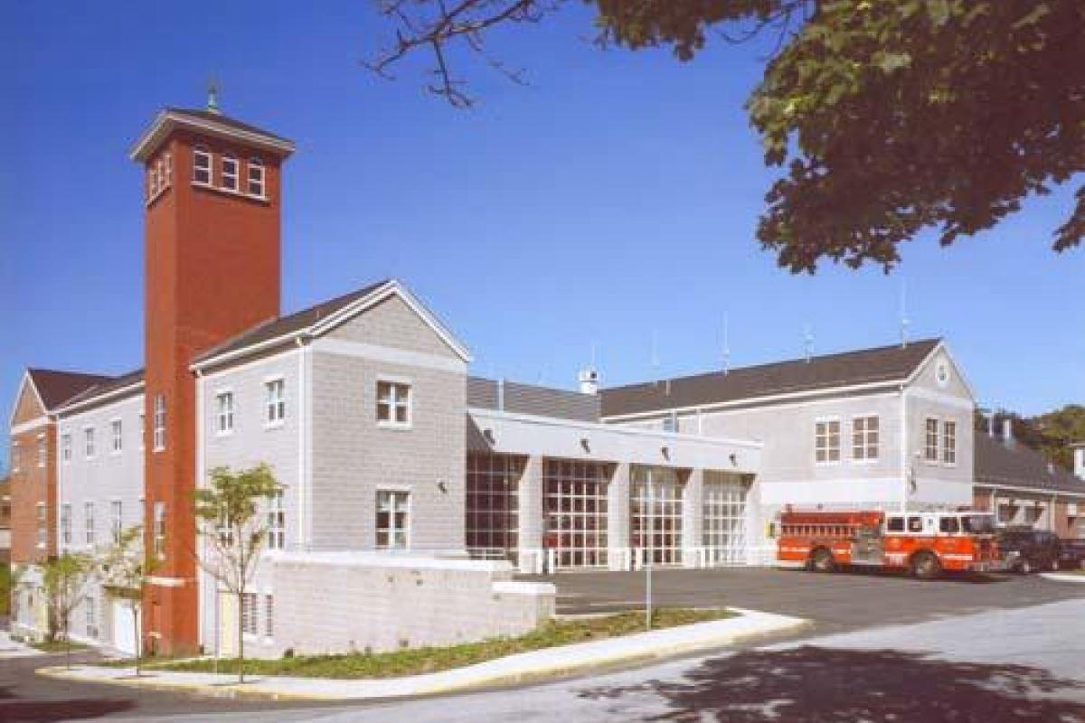 A panoramic of the back of the public safety building which houses the fire department vehicles.